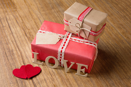 Gifts for Valentine's Day. Decorative boxes and felt hearts