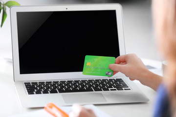 Female making online payment, close up