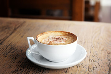 Cup of tasty cappuccino in cafe