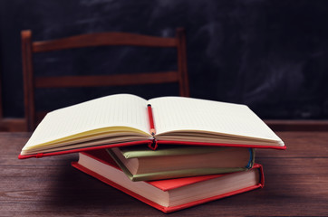 Books and school accessories on wooden table