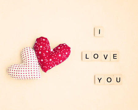 Two vintage stuffed hearts and I Love You message