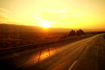 Beautiful golden sunrise over the road