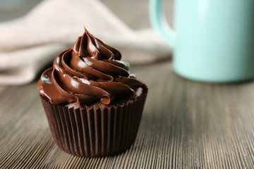 Chocolate cupcakes with drink on table