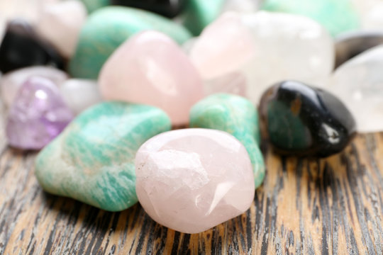 Semiprecious stones on wooden background
