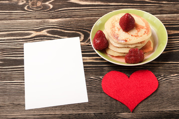 Fototapeta na wymiar sweet pancakes, strawberry, heart, card