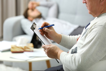 Young man lying on sofa on reception at psychologist
