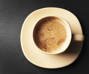 Cup of coffee on gray background