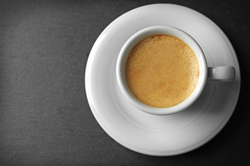 Cup of coffee on gray background