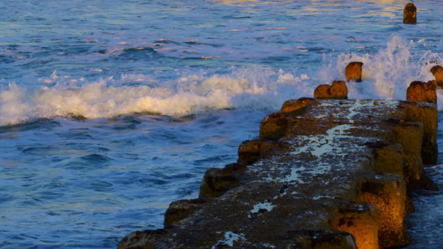 Stock Video Footage of an old, ruined pier at the Mediterranean Sea shot in Israel at 4k with Red.