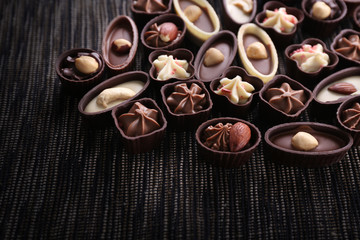Chocolate sweets on fabric background