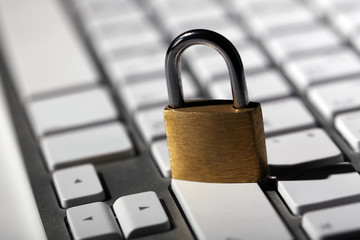 Cyber safety concept - lock on computer keyboard