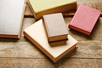 Pile of books on wooden background