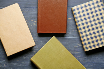 Pile of books on wooden background