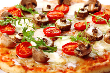 Tasty pizza with mushrooms and tomatoes, close up