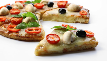 Delicious sliced pizza with vegetables on white background, close up