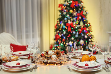 Christmas table setting with holiday decorations background
