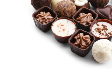 Assorted collection of chocolate candies and sweets, isolated on white