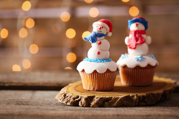 Christmas cupcakes on wooden stand