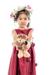 Beautiful little girl in red dress with Teddy Bear isolated on white background