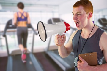 Angry personal trainer yelling through megaphone