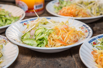 Side dish Vegetable consit papaya, cucumber, carrot and sprouts.