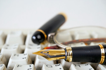 Fountain pen  shot with shallow depth of field on white dirty ke