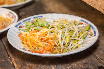 Side dish Vegetable consist papaya, cucumber, carrot and sprouts