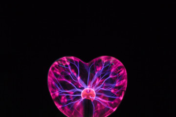 Plasma ball heart glowing in the dark