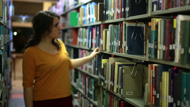 Girl searching for books