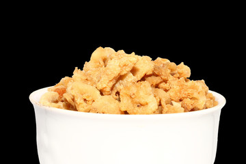 pork crackling in white bowl on isolated background