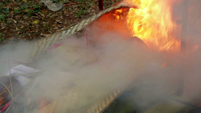 burning dead body in balinese funeral, bali, indonesia