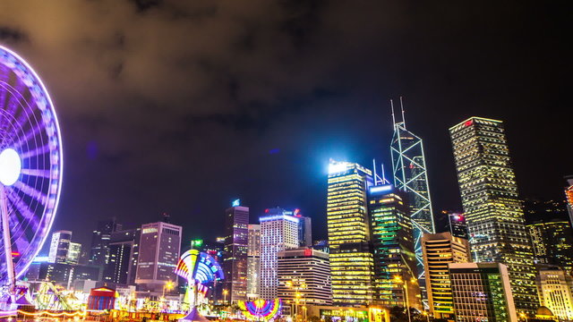 Colorful Ferris wheel with a darkening sky. Hongkong. Timelapse