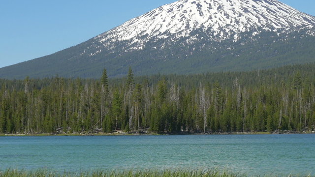 Zooming out view of Mount Bachelor with Little Lava Lake in the foreground, then pan left to Broken Top.