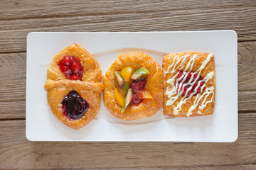 danish pastry with fruits on white dish