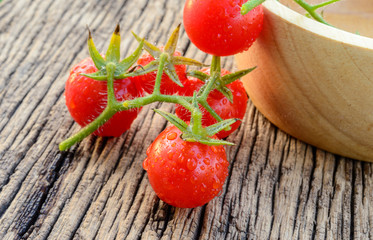 Red, fresh tomatoes on the wooden planks