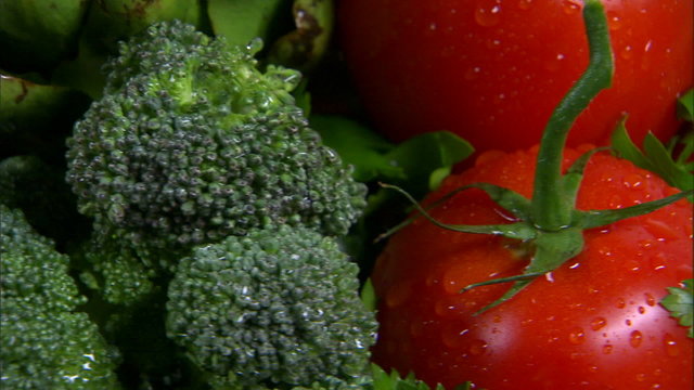 Close shot of an assortment of vegetables rotating.
