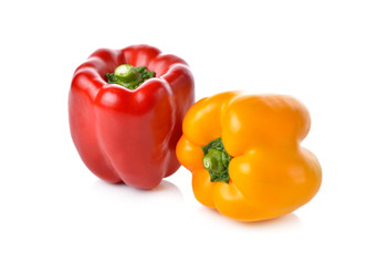 red, yellow bell pepper on white background