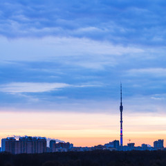 Naklejka premium Early blue sunrise and cityscape with TV tower