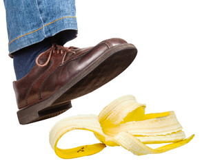 right foot in jeans and shoe slips on banana peel