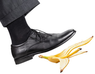 leg in the right black shoe slips on a banana peel