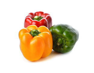 red, yellow, green bell pepper on white background