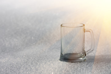 Glass mug in the snow