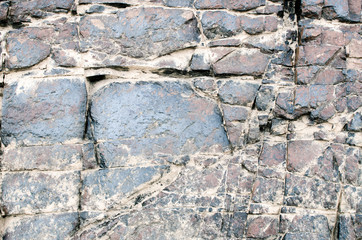 Fototapeta premium Blue stone wall texture and background, Outdoor view