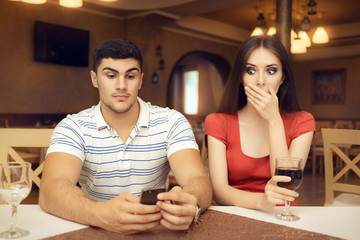 Shocked Girl Spying Boyfriend on Smartphone