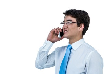 Smiling asian businessman using his telephone