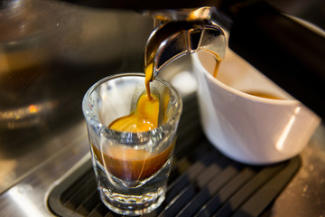 close up of espresso machine making coffee