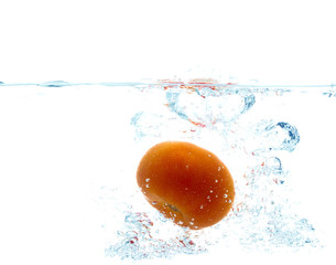 tomato falling or dipping in water with splash