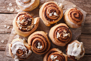 Glazed Cinnamon rolls with almond close up. horizontal top view
