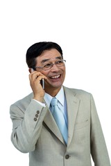 Smiling asian businessman phone calling