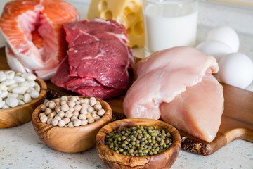 Selection of protein sources in kitchen background - obrazy, fototapety, plakaty
